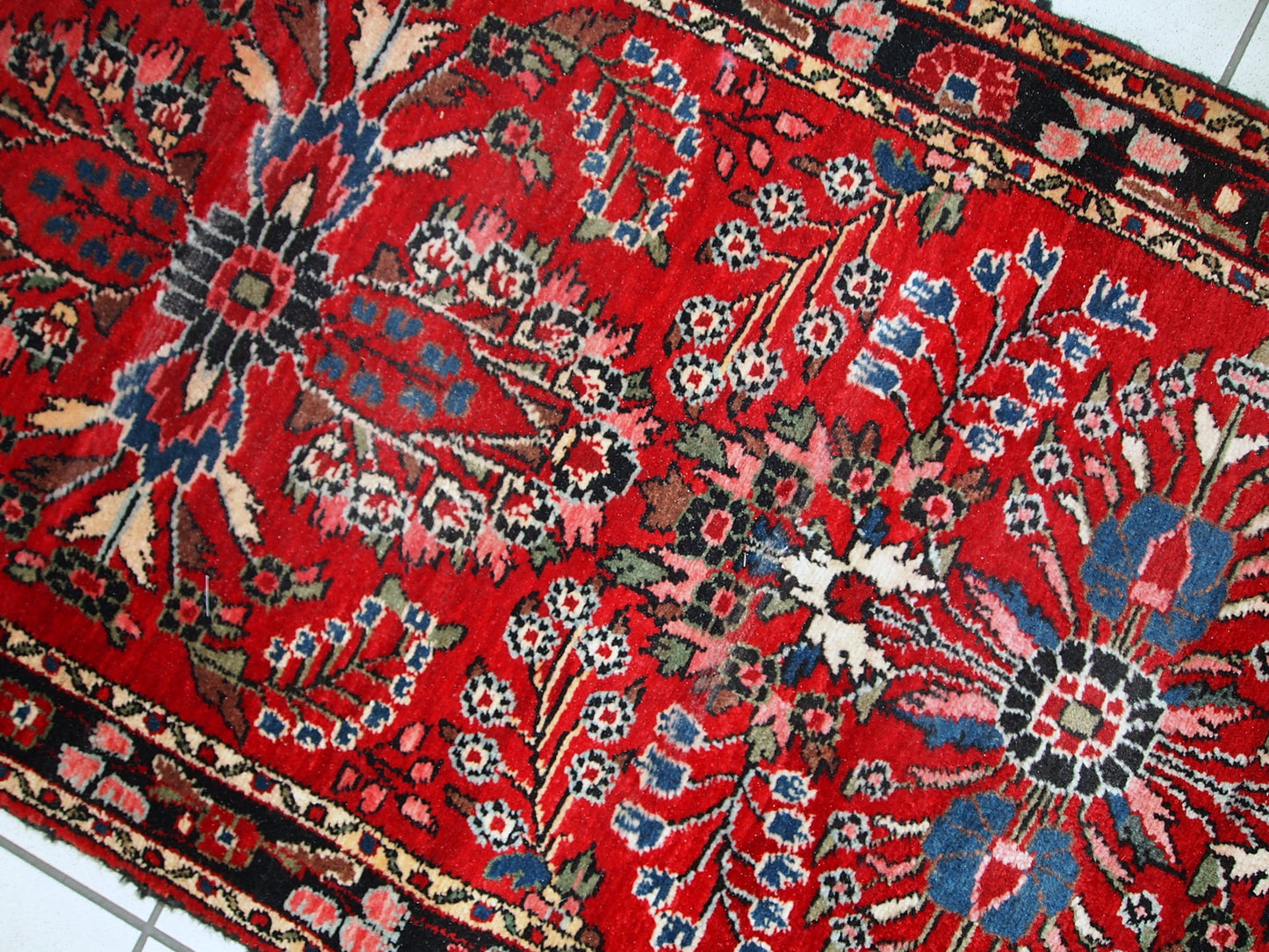 Hand made antique Persian Lilihan runner in original condition, it has several areas with low pile. This runner is heavy, it has been made in the beginning of 20th century.