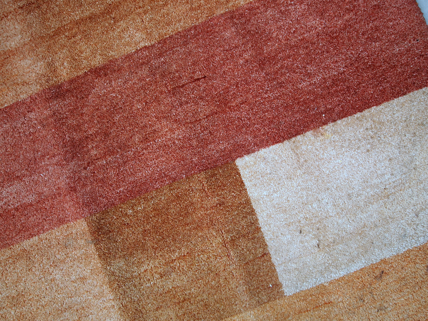 Vintage Persian Gabbeh rug in original good condition. It is in brownish, beige and red wool with geometric design, made in the end of 20th century.