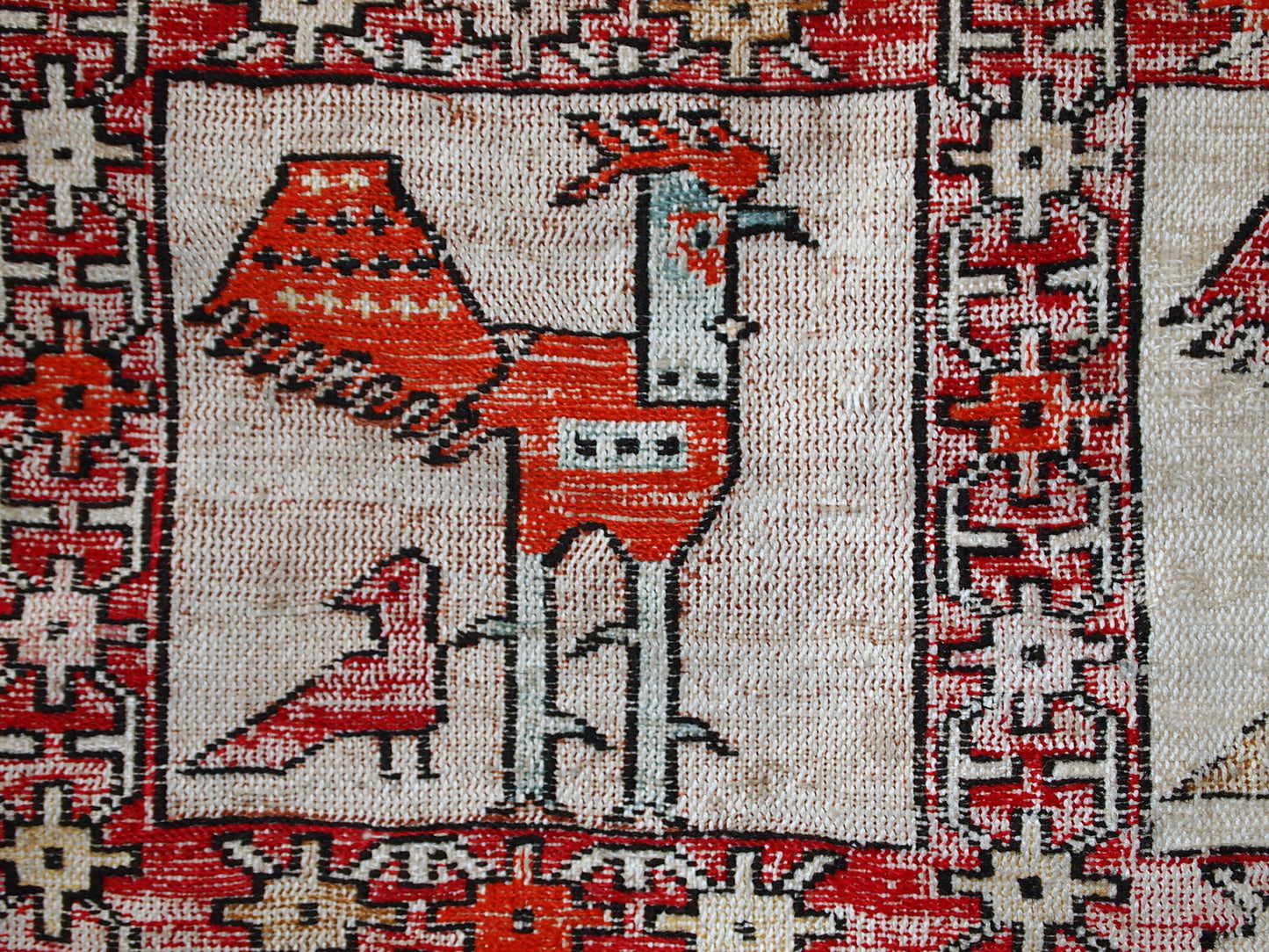 Vintage Persian flat-weave in original good condition. This kilim was made out of artificial silk on cotton base. It has very unusual design of repeated roosters in different shades. It has been made with an accent of warn effect, but it is actually in original good condition.