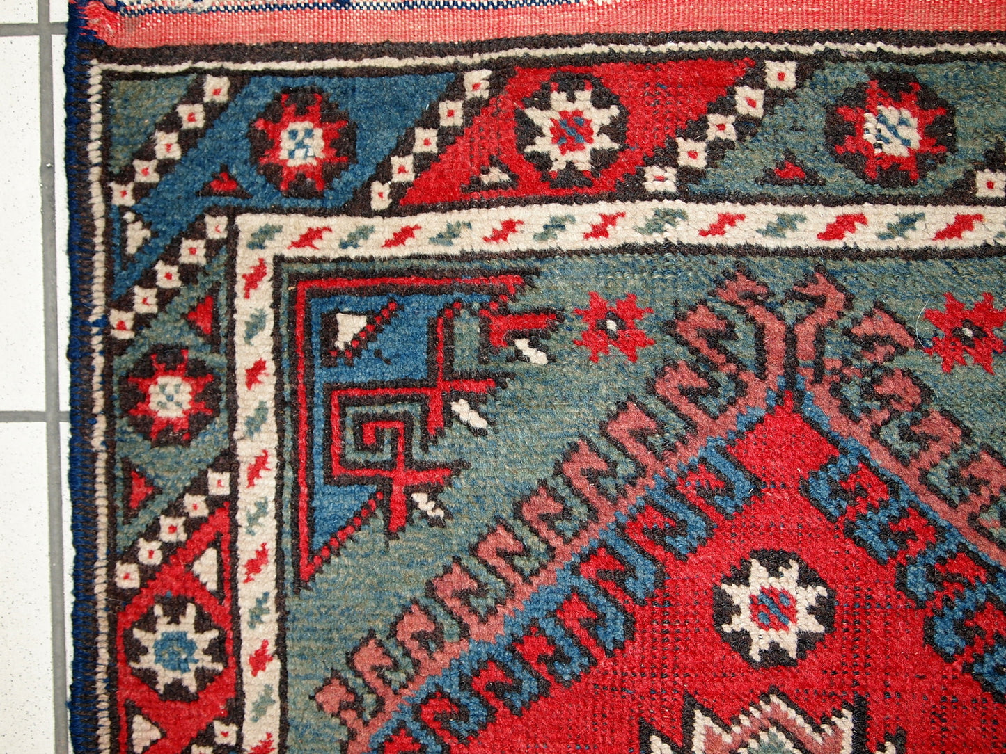 Turkish Anatolian antique handmade rug in bright red and green shades. The rug is in original good condition, it has some low pile.