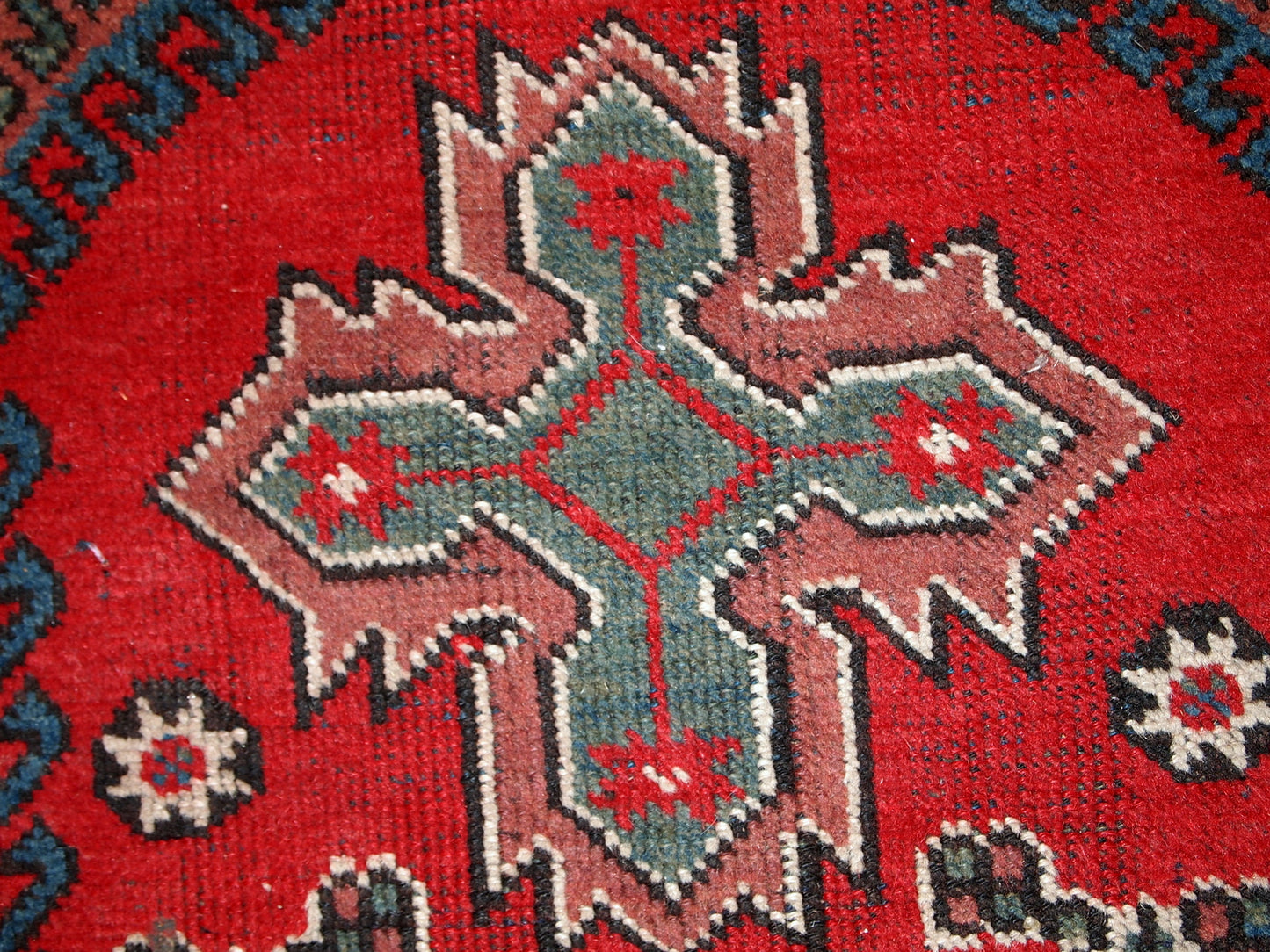 Turkish Anatolian antique handmade rug in bright red and green shades. The rug is in original good condition, it has some low pile.