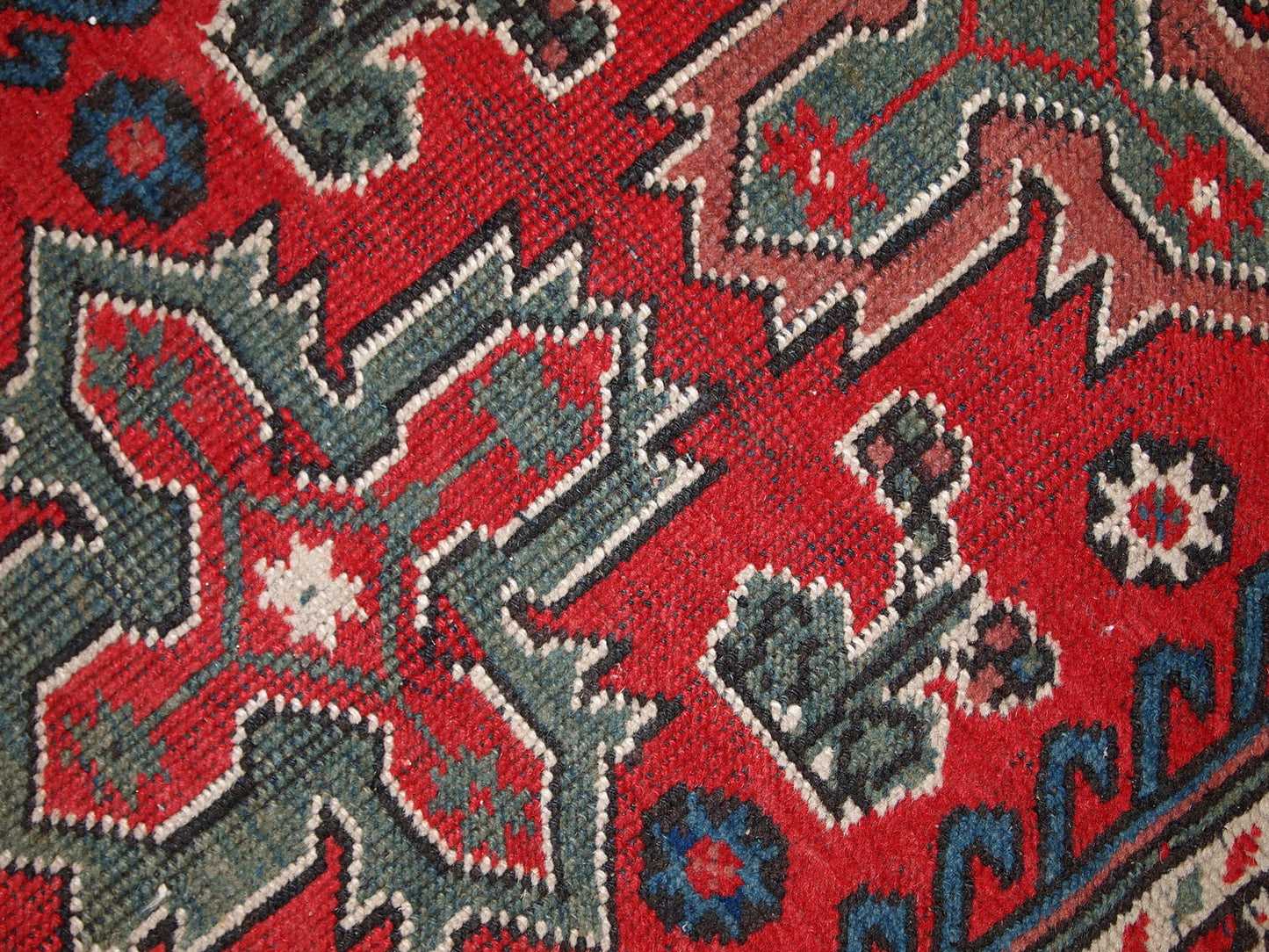 Turkish Anatolian antique handmade rug in bright red and green shades. The rug is in original good condition, it has some low pile.
