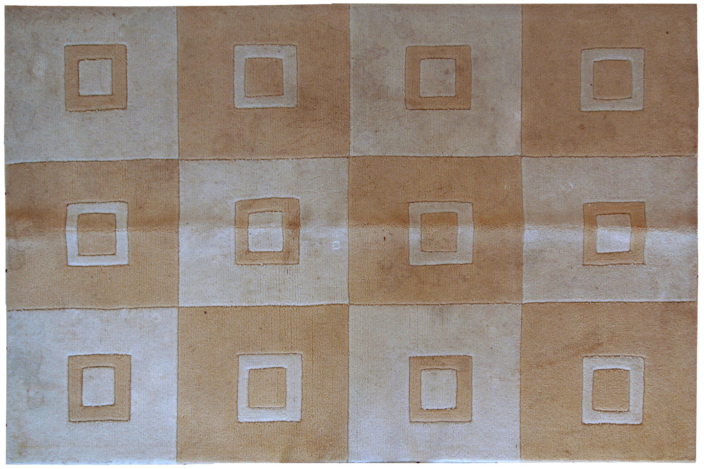 Handmade Chinese rug in light shades of white and brown. It has modern geometric design. The rug made out of acrylic in China. It is in original condition, has some age discolorations.