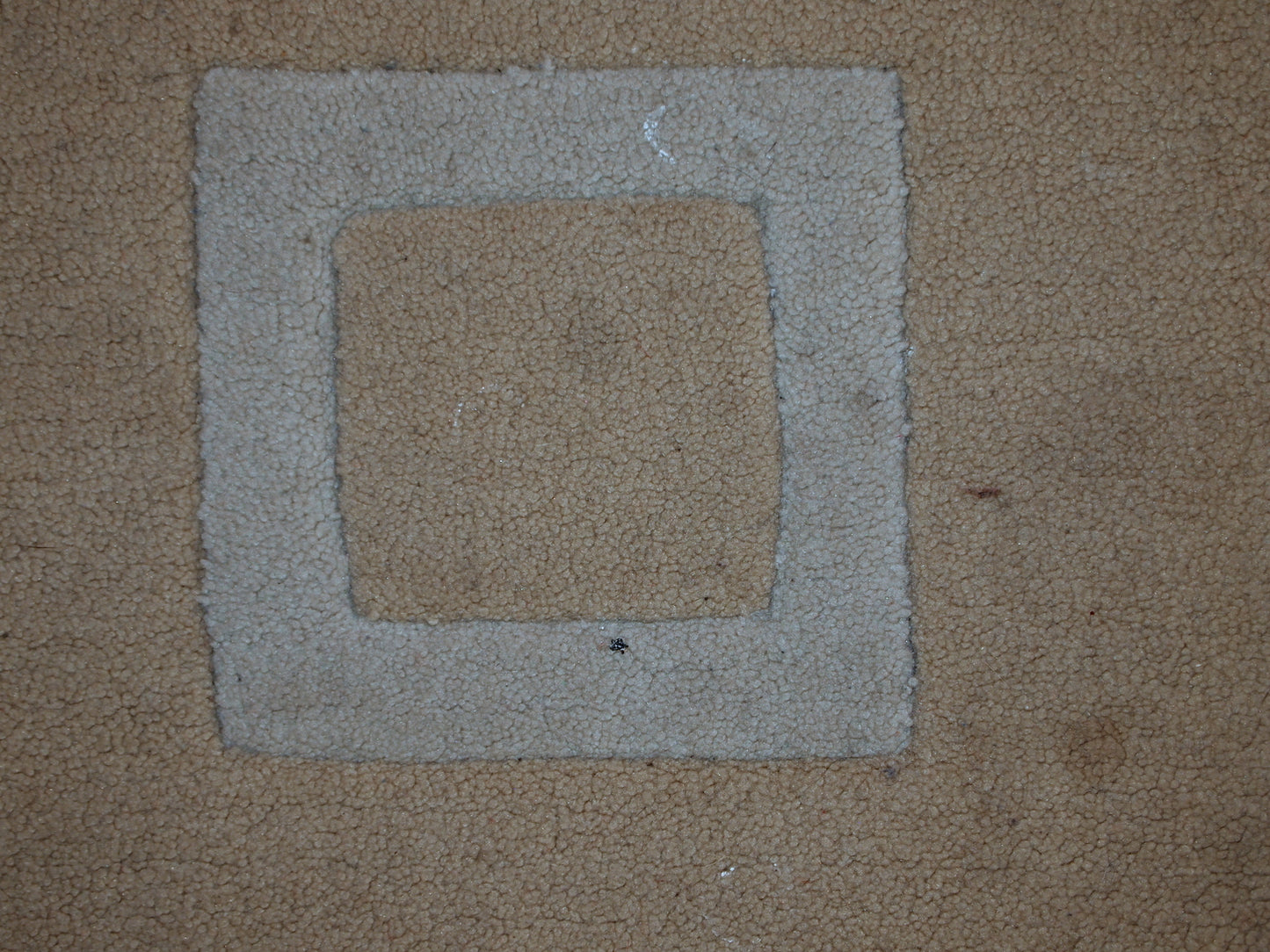 Handmade Chinese rug in light shades of white and brown. It has modern geometric design. The rug made out of acrylic in China. It is in original condition, has some age discolorations.