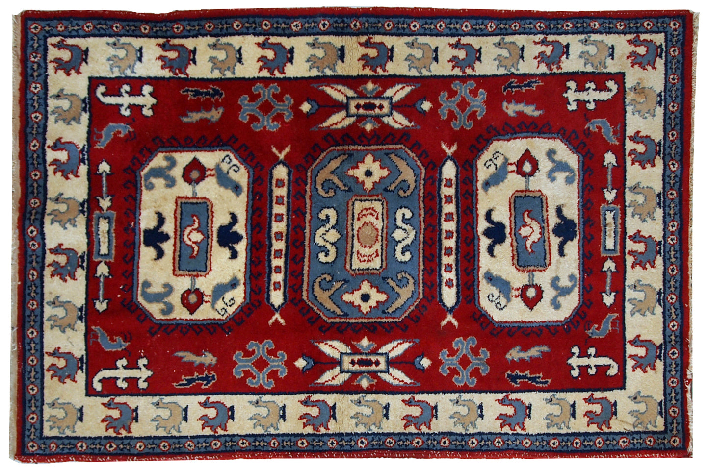 Handmade Russian vintage rug in deep red shade. The beige border decorated in roosters. Made out of wool, the rug is very thick and warm. It is in original good condition.