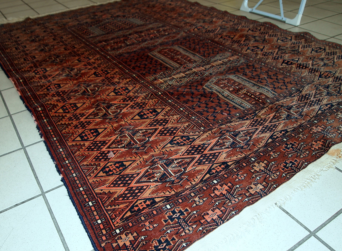 Semi-antique Turkmen Hachli prayer handmade rug in original good condition. The rug has fine weave and it is very thin. The rug is in burgundy, pink, navy blue and white shades.