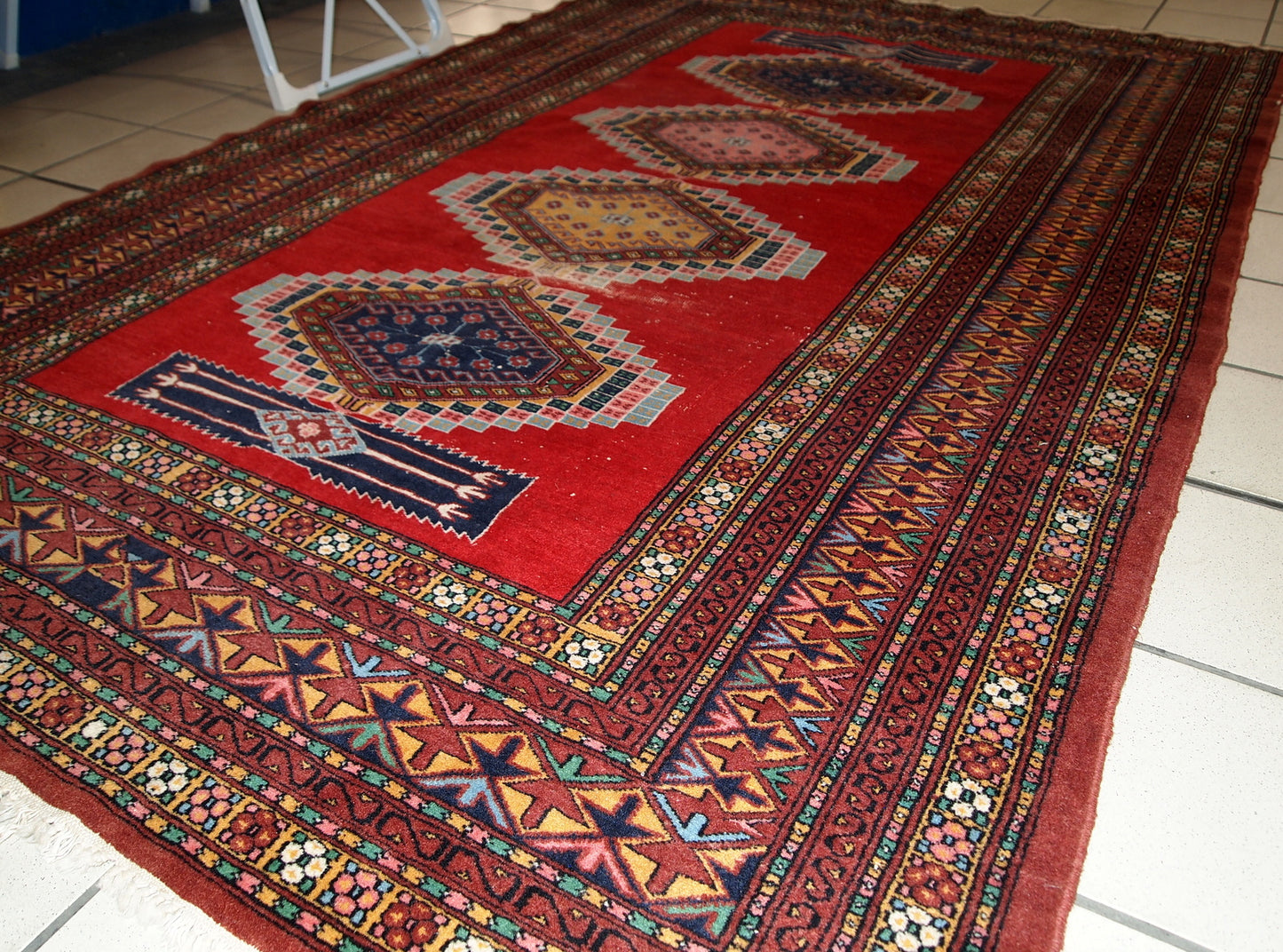 Handmade vintage distressed Uzbek Bukhara rug, 1960s