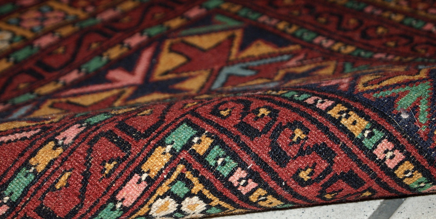 Handmade vintage distressed Uzbek Bukhara rug, 1960s
