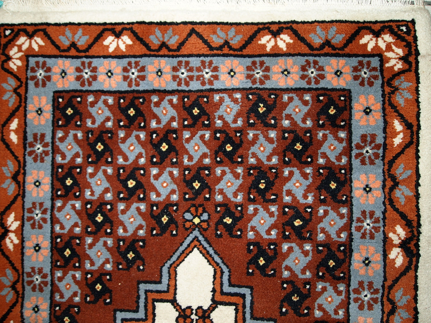 Vintage Berber rug from Morocco in original good condition. The rug made in the end of 20th century in wool.