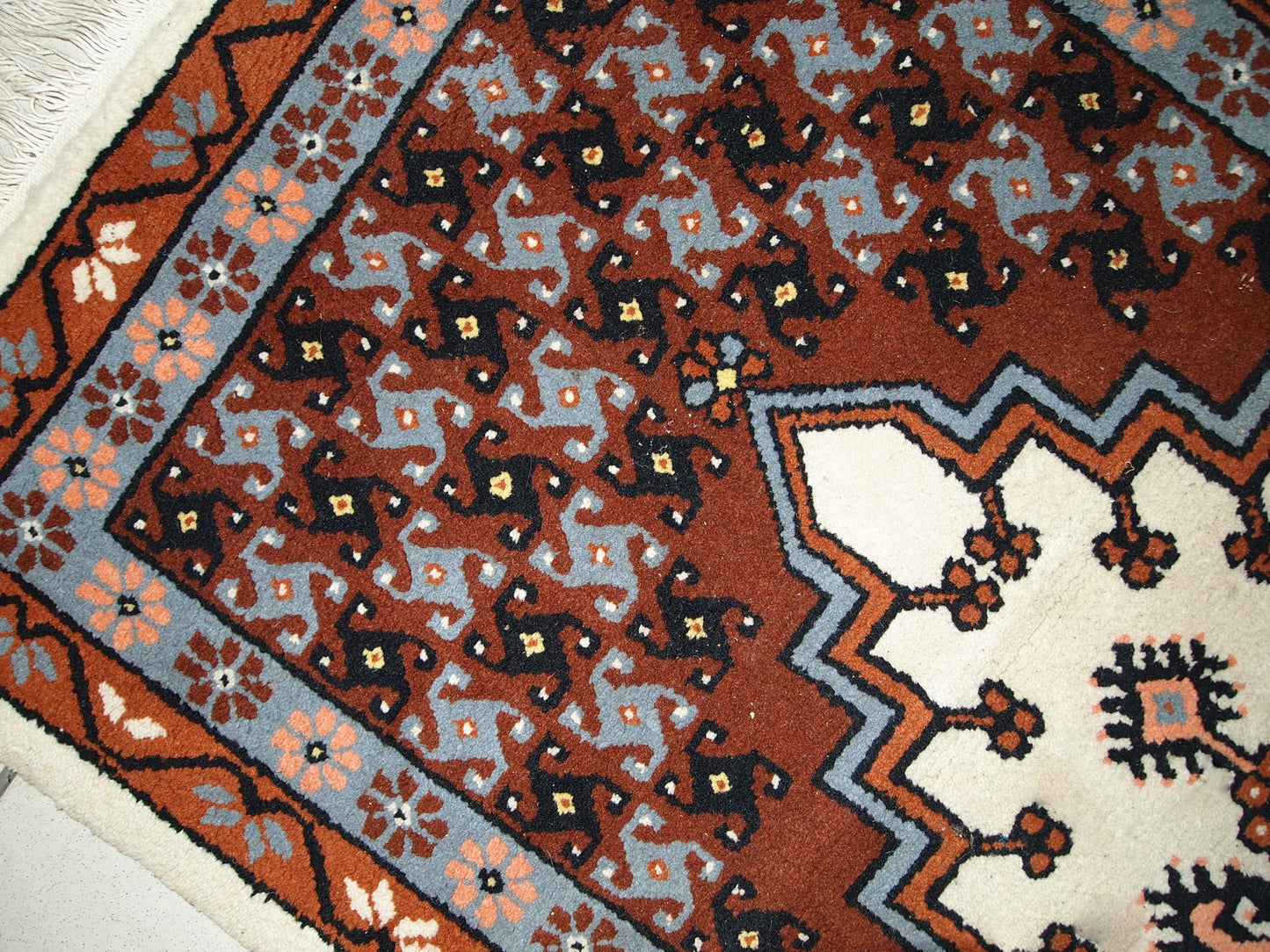Vintage Berber rug from Morocco in original good condition. The rug made in the end of 20th century in wool.