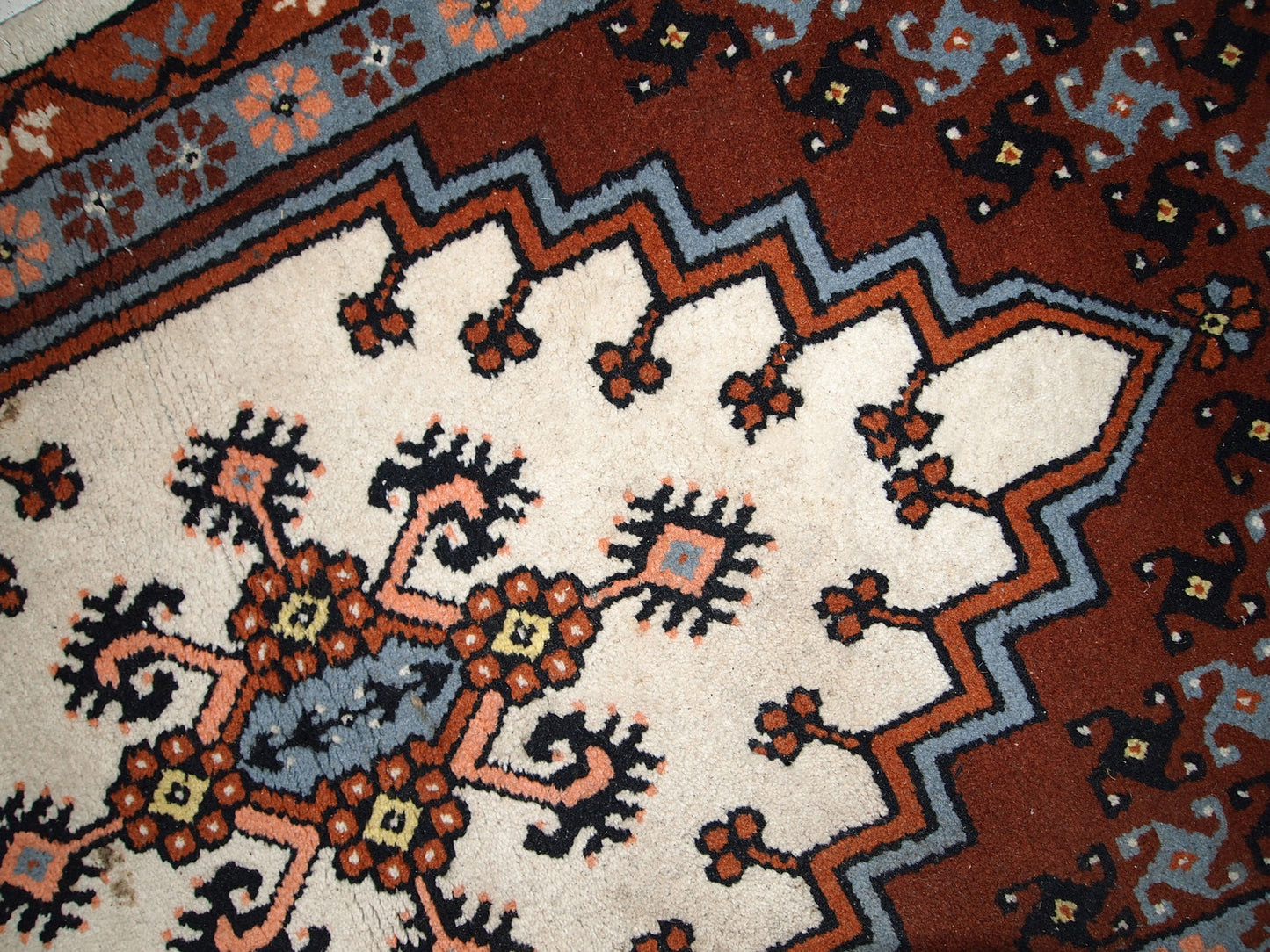Vintage Berber rug from Morocco in original good condition. The rug made in the end of 20th century in wool.