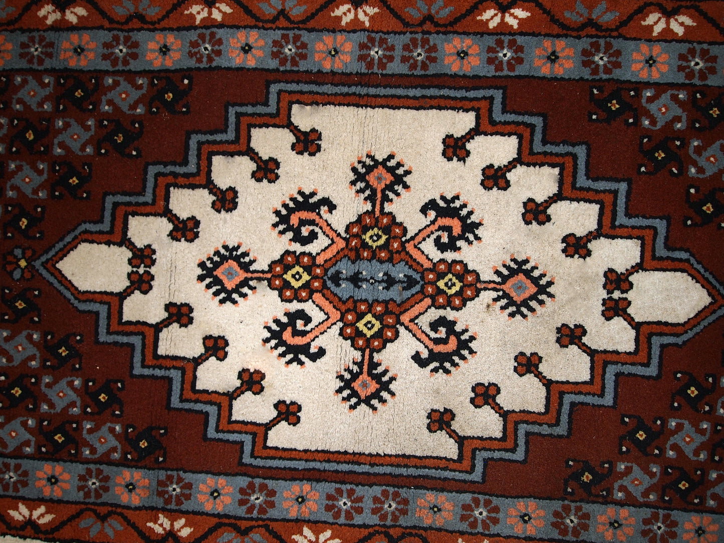 Vintage Berber rug from Morocco in original good condition. The rug made in the end of 20th century in wool.