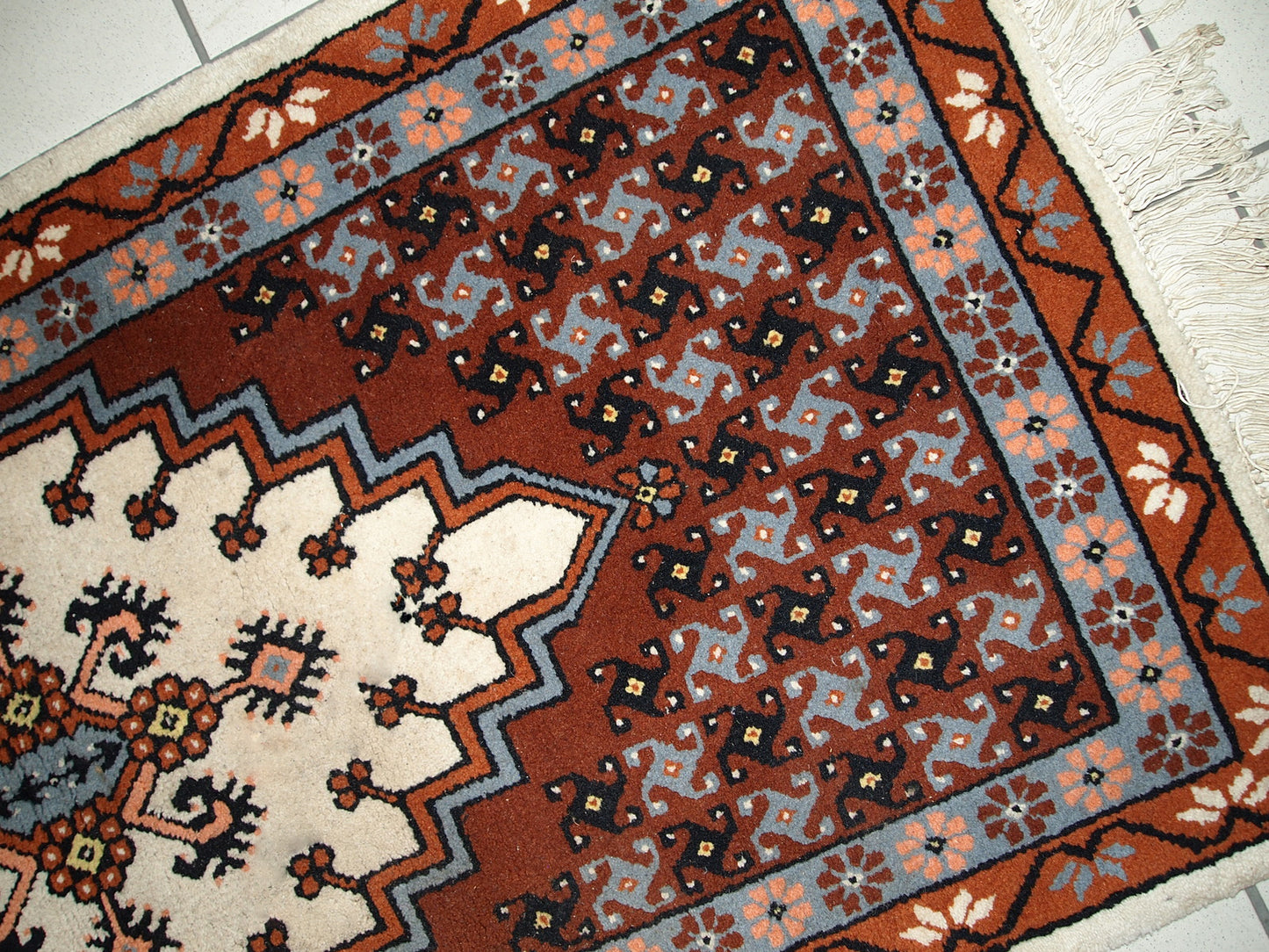 Vintage Berber rug from Morocco in original good condition. The rug made in the end of 20th century in wool.
