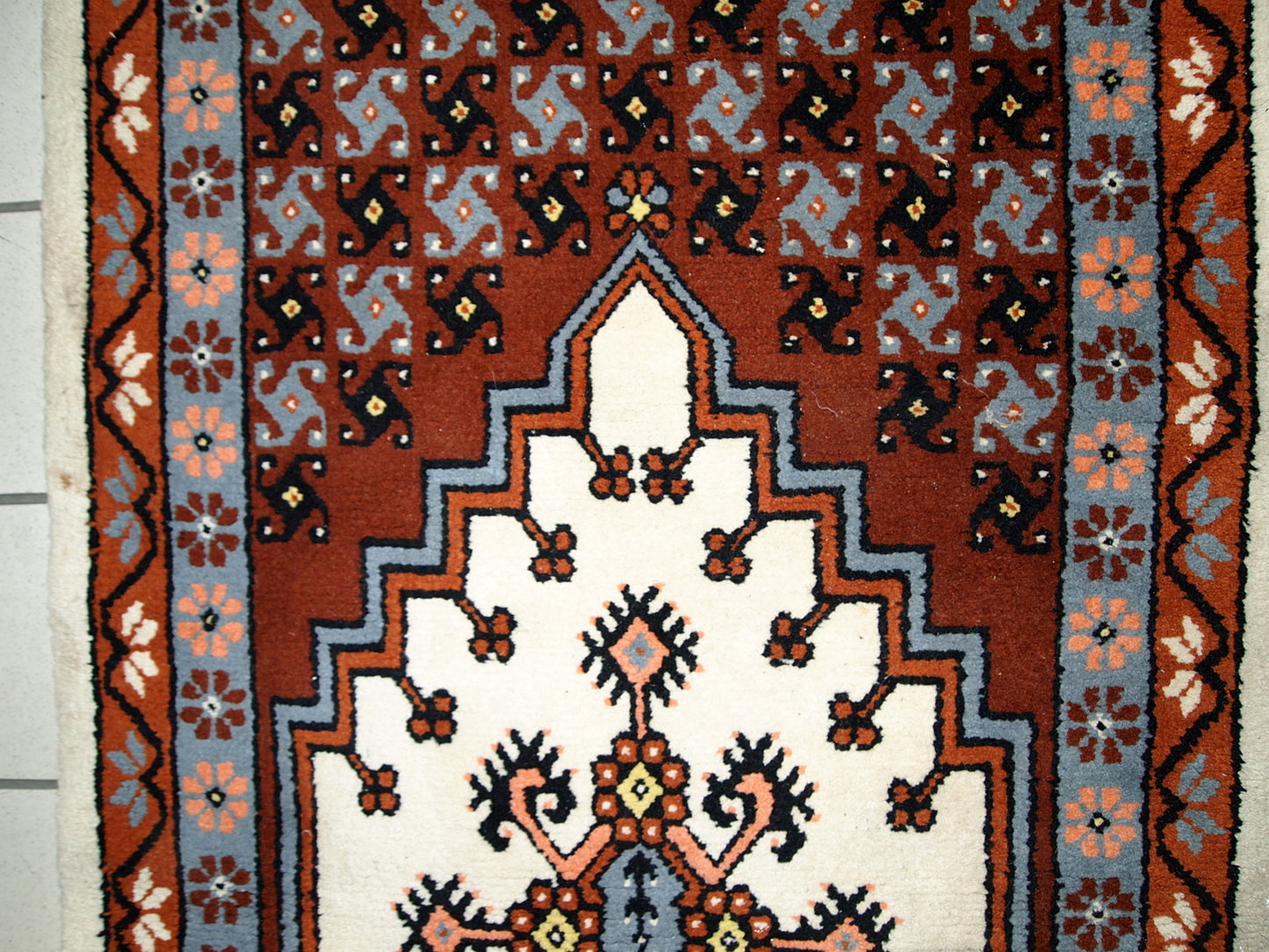 Vintage Berber rug from Morocco in original good condition. The rug made in the end of 20th century in wool.