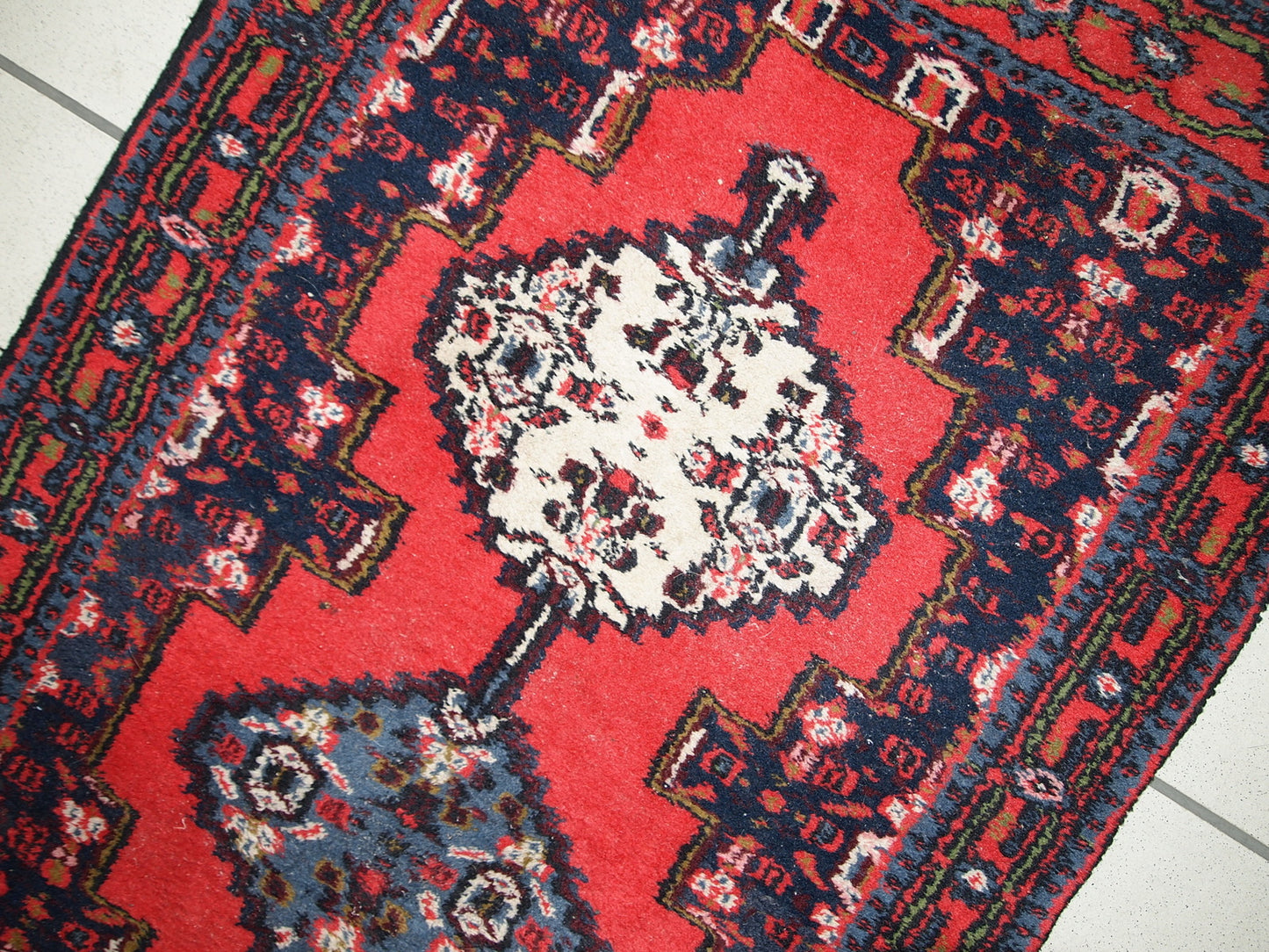 Handmade vintage Persian Hamadan rug in bright red color. The rug is in original good condition from the end of 20th century.