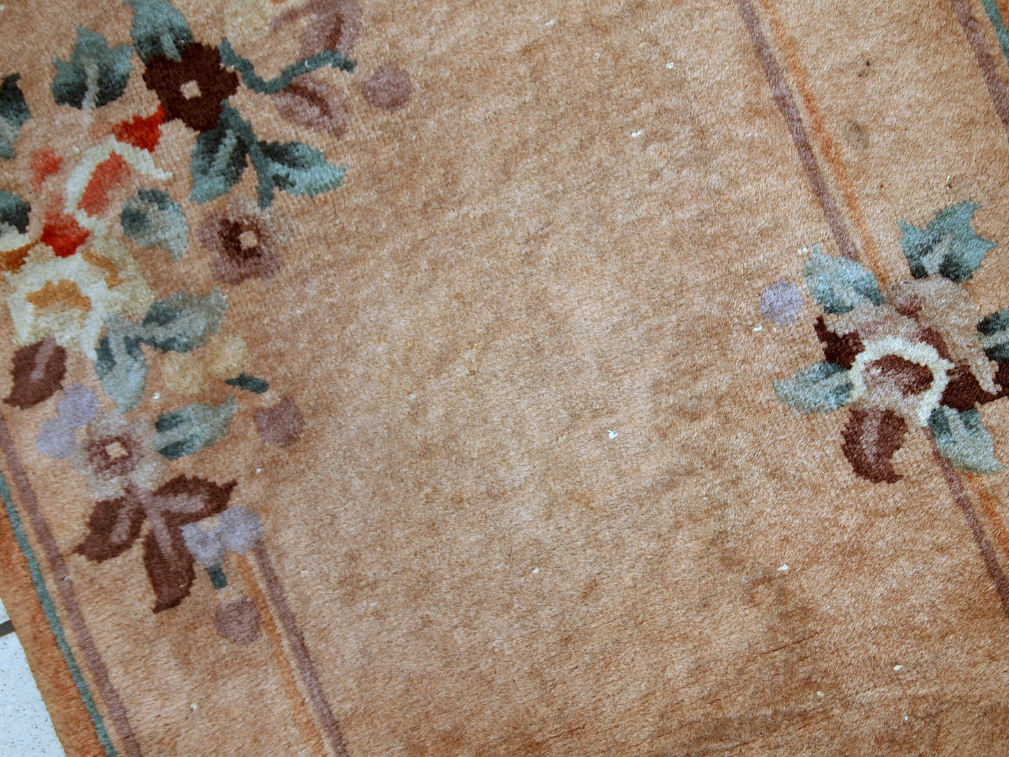 Handmade vintage Art Deco Chinese rug in light brown shade. The rug is from the middle of 20th century in original condition, it has some low pile.