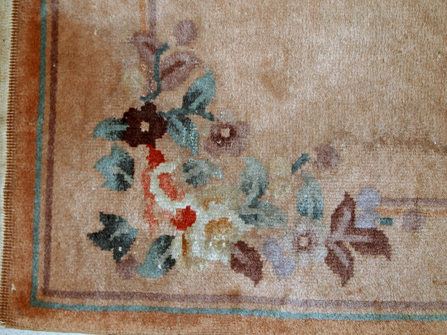 Handmade vintage Art Deco Chinese rug in light brown shade. The rug is from the middle of 20th century in original condition, it has some low pile.