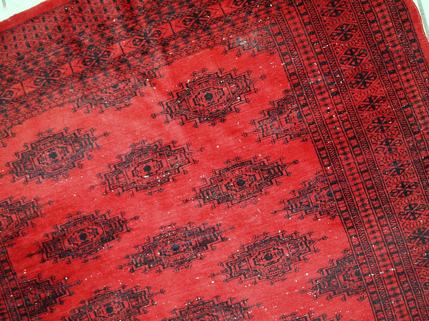 Handmade vintage rug from Afghanistan from the end of 20th century. The rug is in original condition, it has one patch.