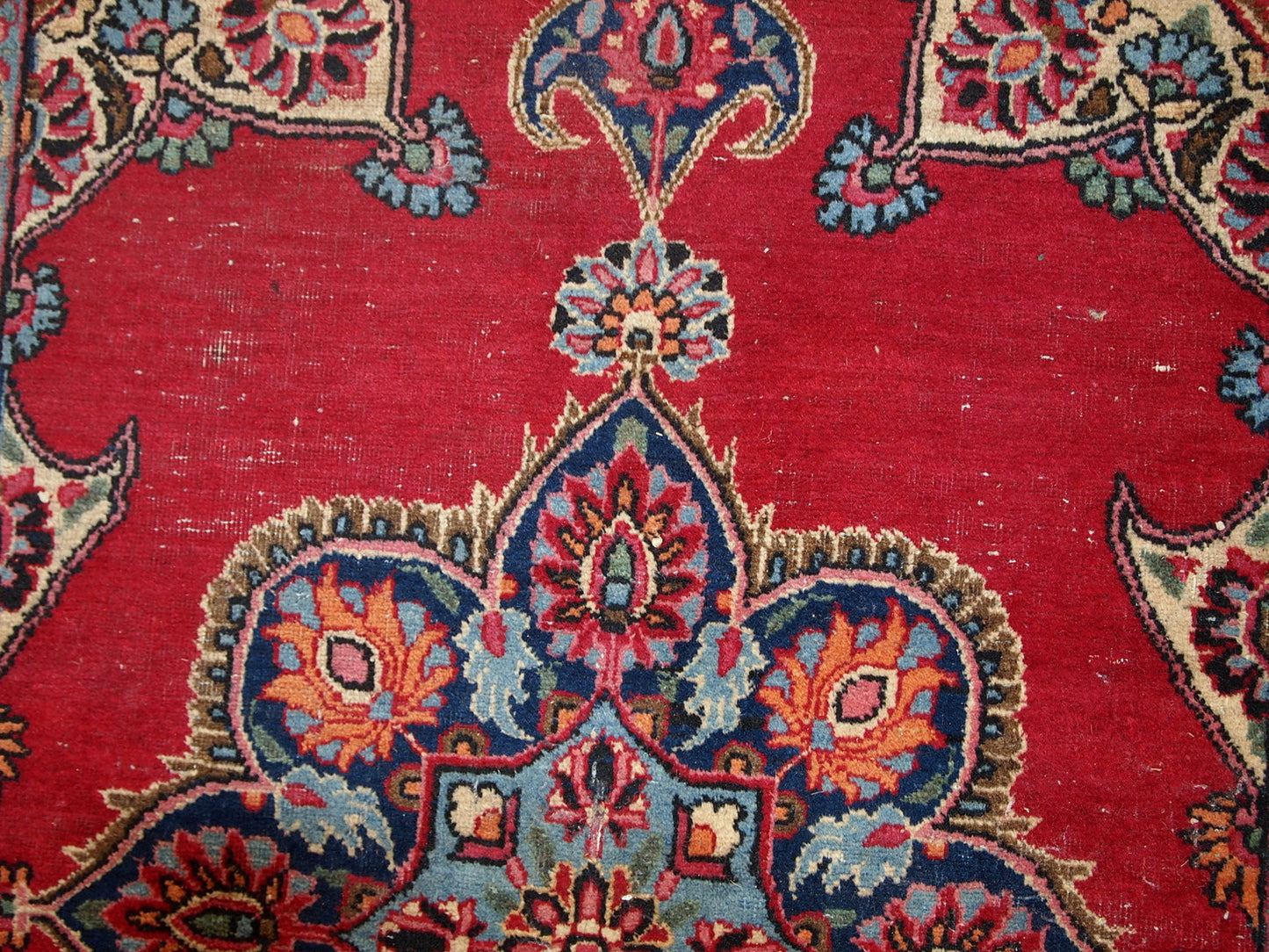 Vintage Persian Kazvin rug in bright red color. The rug is from the end of 20th century. It is in original condition, has some low pile.