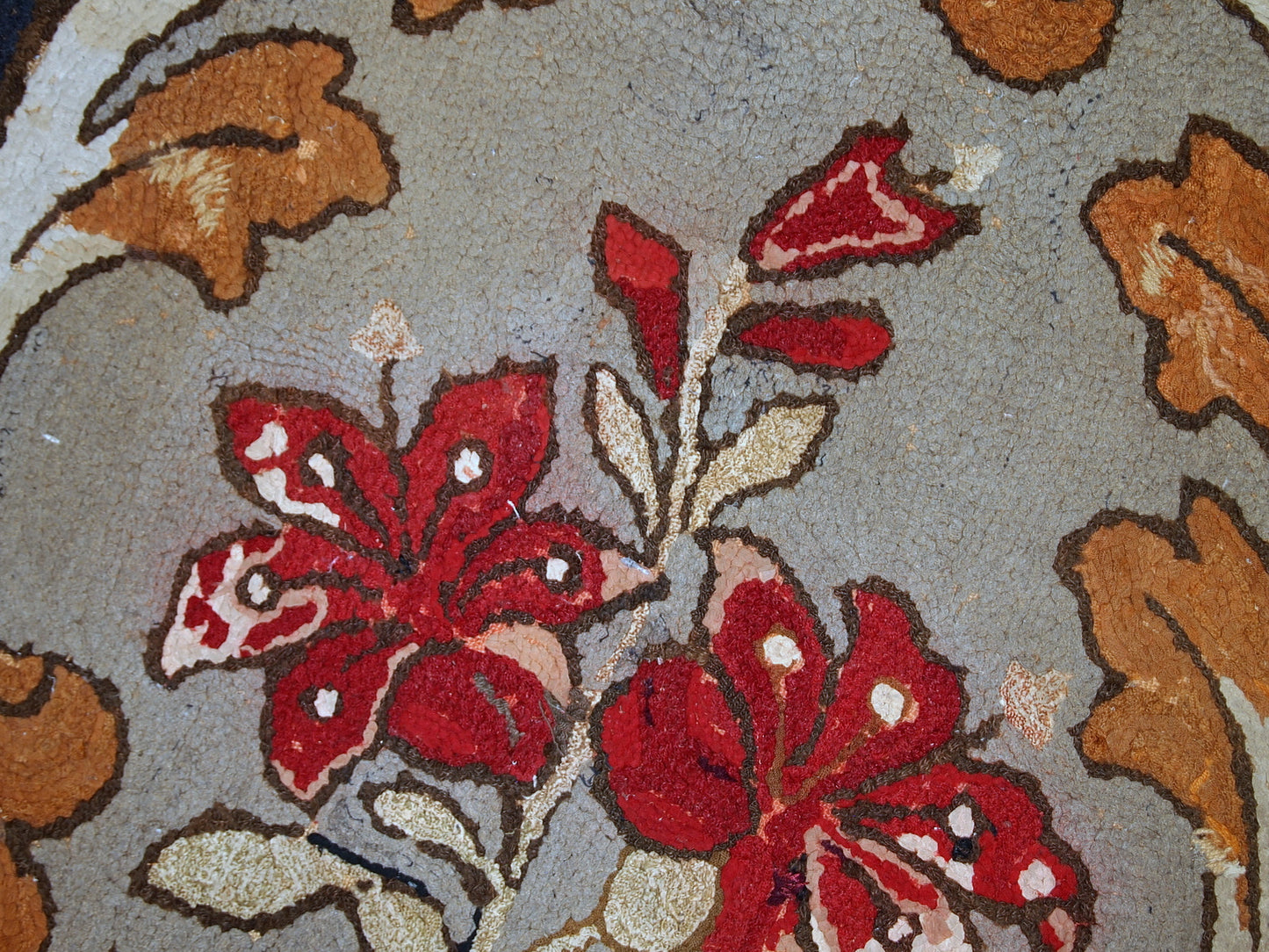 Handmade antique American Hooked rug in floral design. The rug has been made in the beginning of 20th century in USA. It is in original condition, has some signs of age.