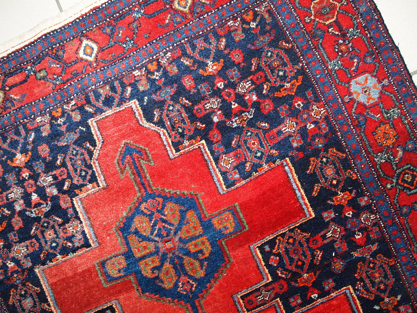 Handmade vintage Persian Senneh rug in original good condition. The rug is from the middle of 20th century, made in wool.