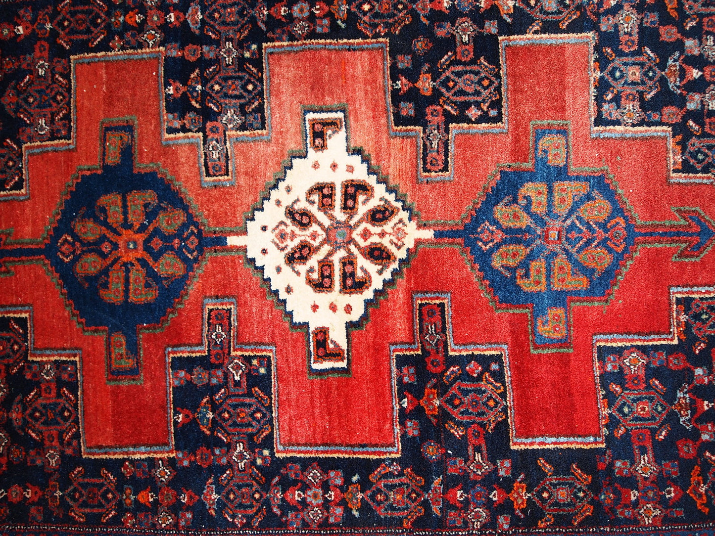Handmade vintage Persian Senneh rug in original good condition. The rug is from the middle of 20th century, made in wool.