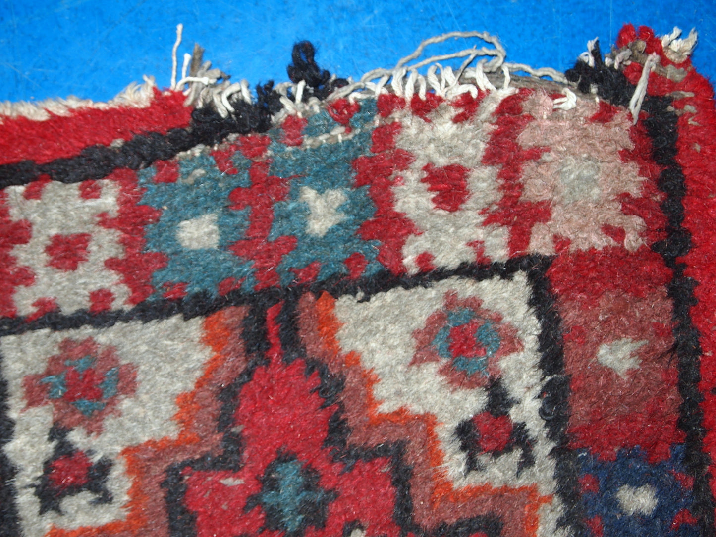 Vintage handmade Middle Eastern mat in original condition, it has some age wear. The rug is from the end of 20th century.