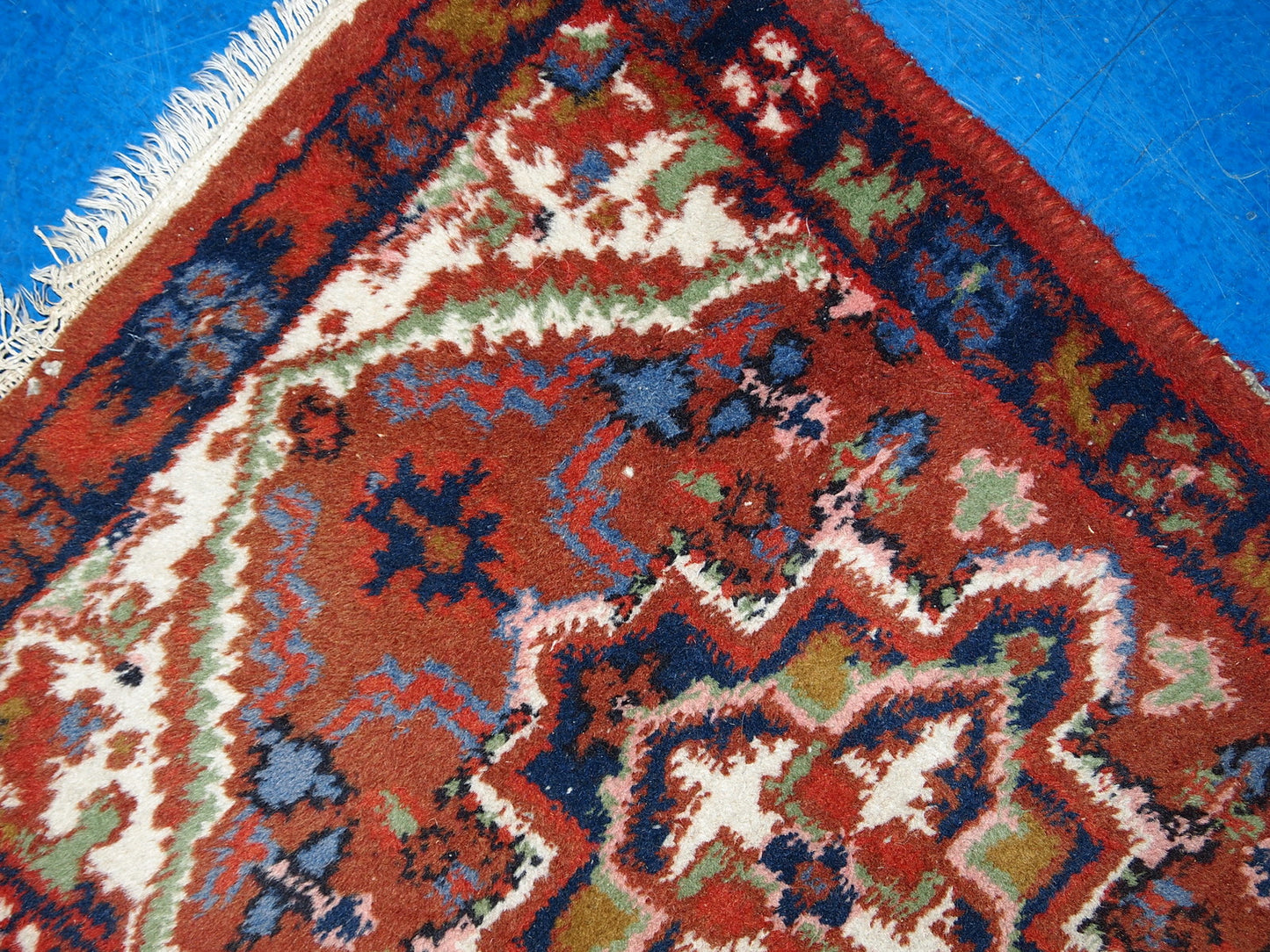 Vintage handmade Middle Eastern Hamadan mat in original good condition. The rug is from the end of 20th century in brick red colour.