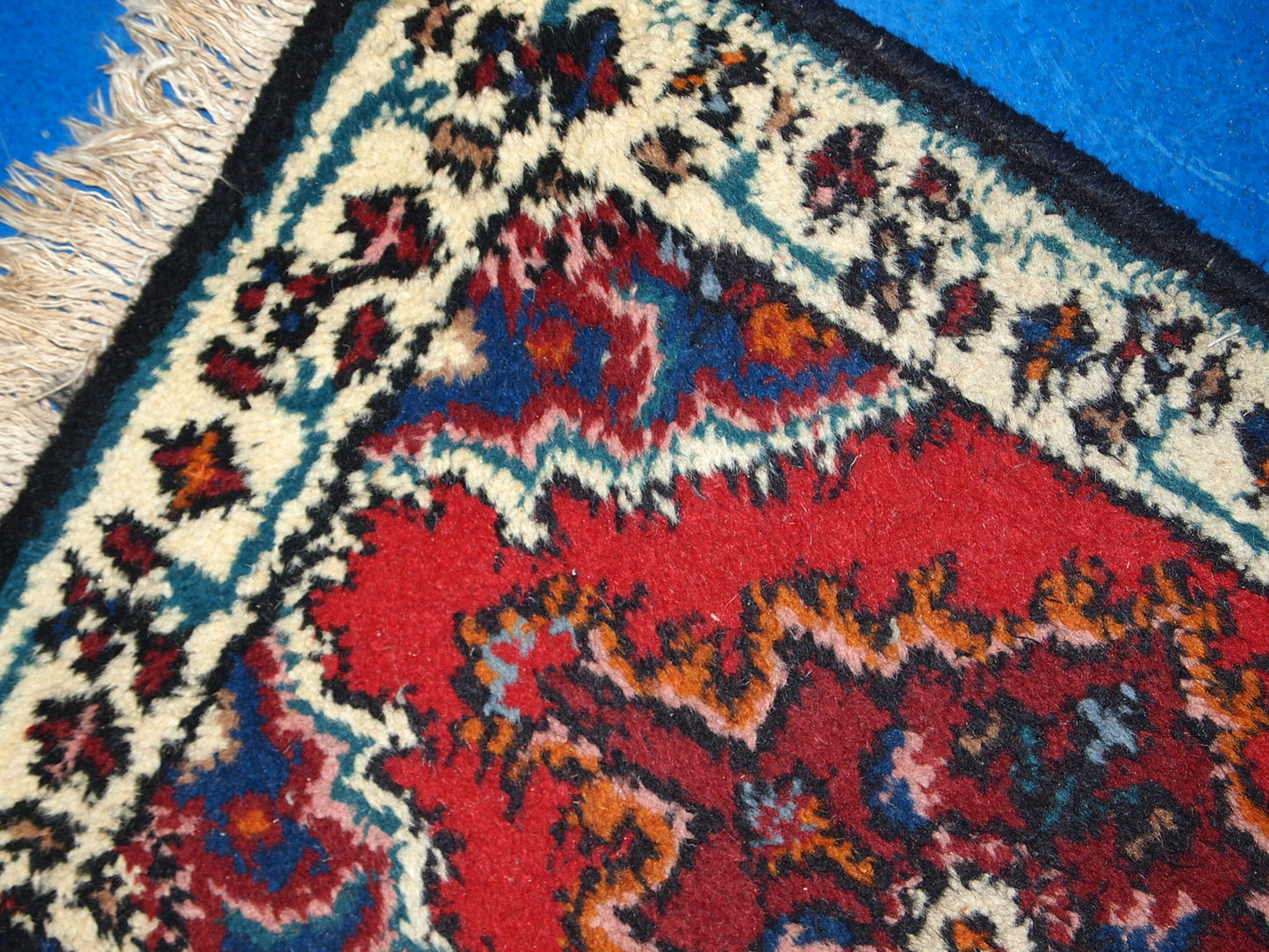 Vintage handmade Middle Eastern mat in original good condition. The rug is from the end of 20th century.