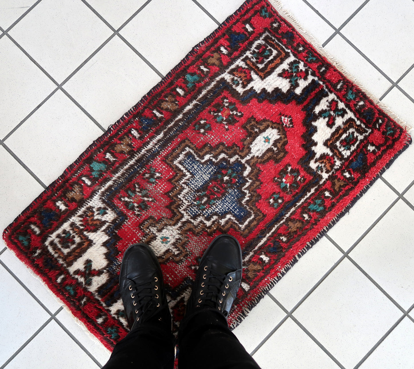 Handmade vintage Persian Hamadan rug in distressed condition. The rug has been made in wool in the end of 20th century.
