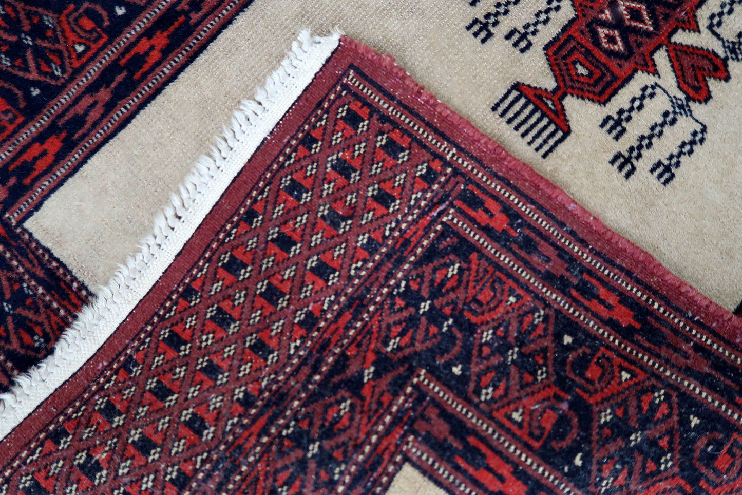 Handmade vintage Uzbek Bukhara runner in traditional design. The rug is from the end of 20th century made in wool.