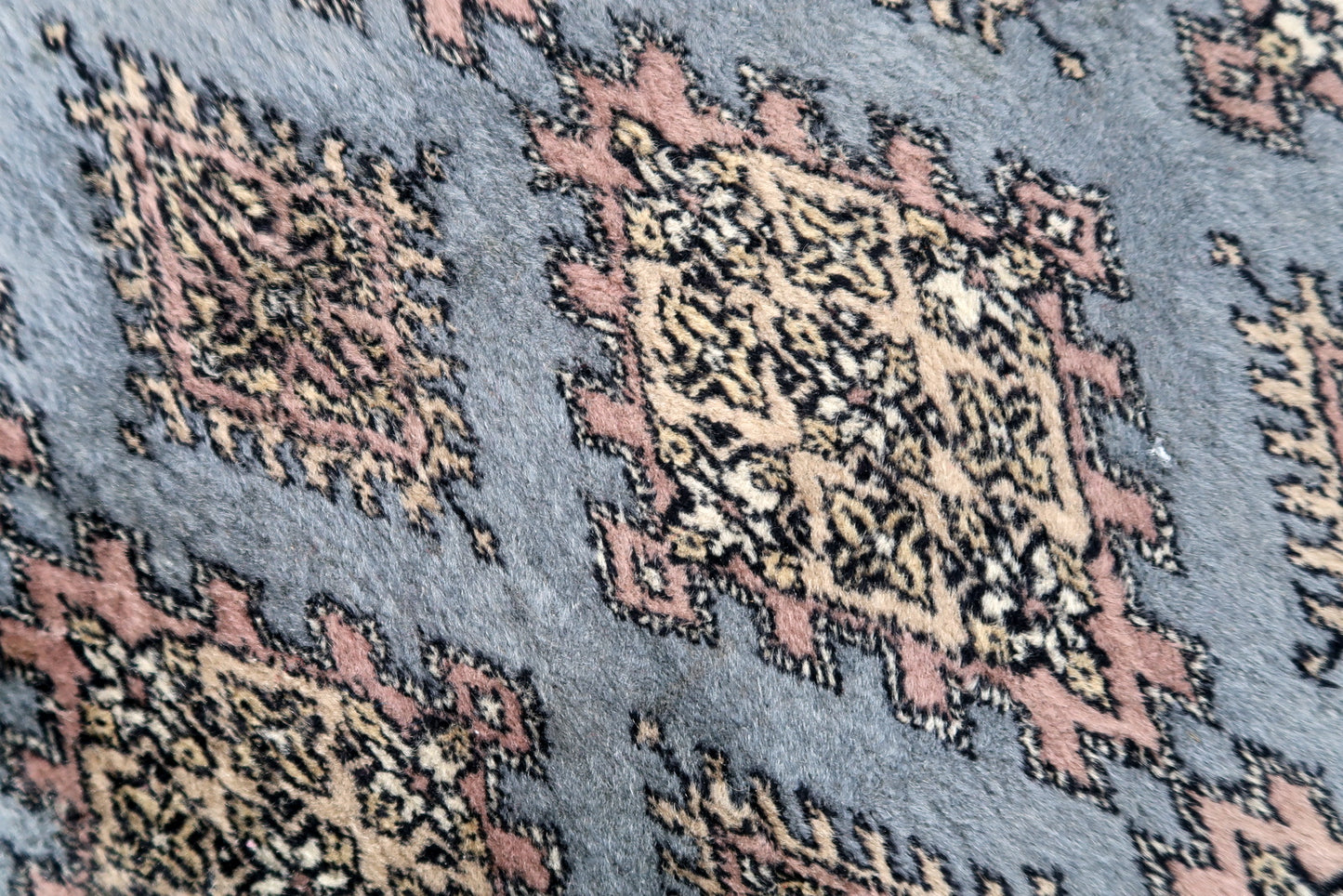 Handmade vintage Uzbek Bukhara runner in traditional design. The rug is from the end of 20th century made in wool.