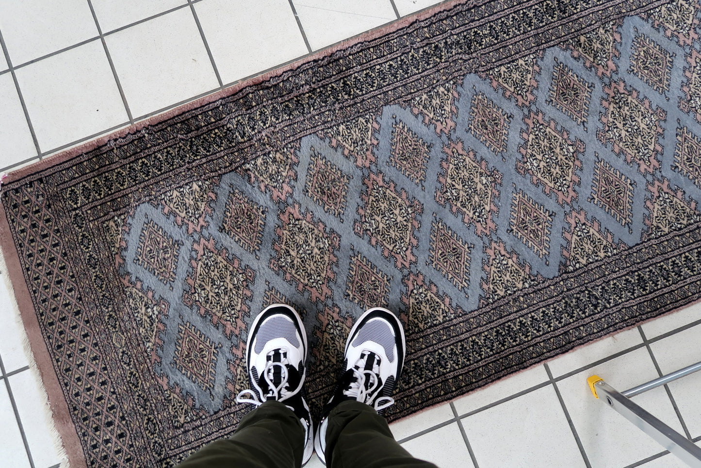 Handmade vintage Uzbek Bukhara runner in traditional design. The rug is from the end of 20th century made in wool.