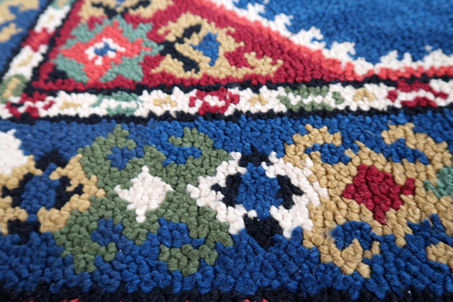 Vintage French Savonnerie rug in blue and red colors. The rug has been made in wool in the end of 20th century. It is in original good condition.