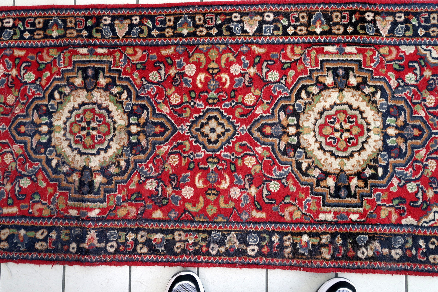 Handmade vintage Persian Malayer runner in red color. The rug has been made in wool in the middle of 20th century. It is in original condition, it has some signs of age.