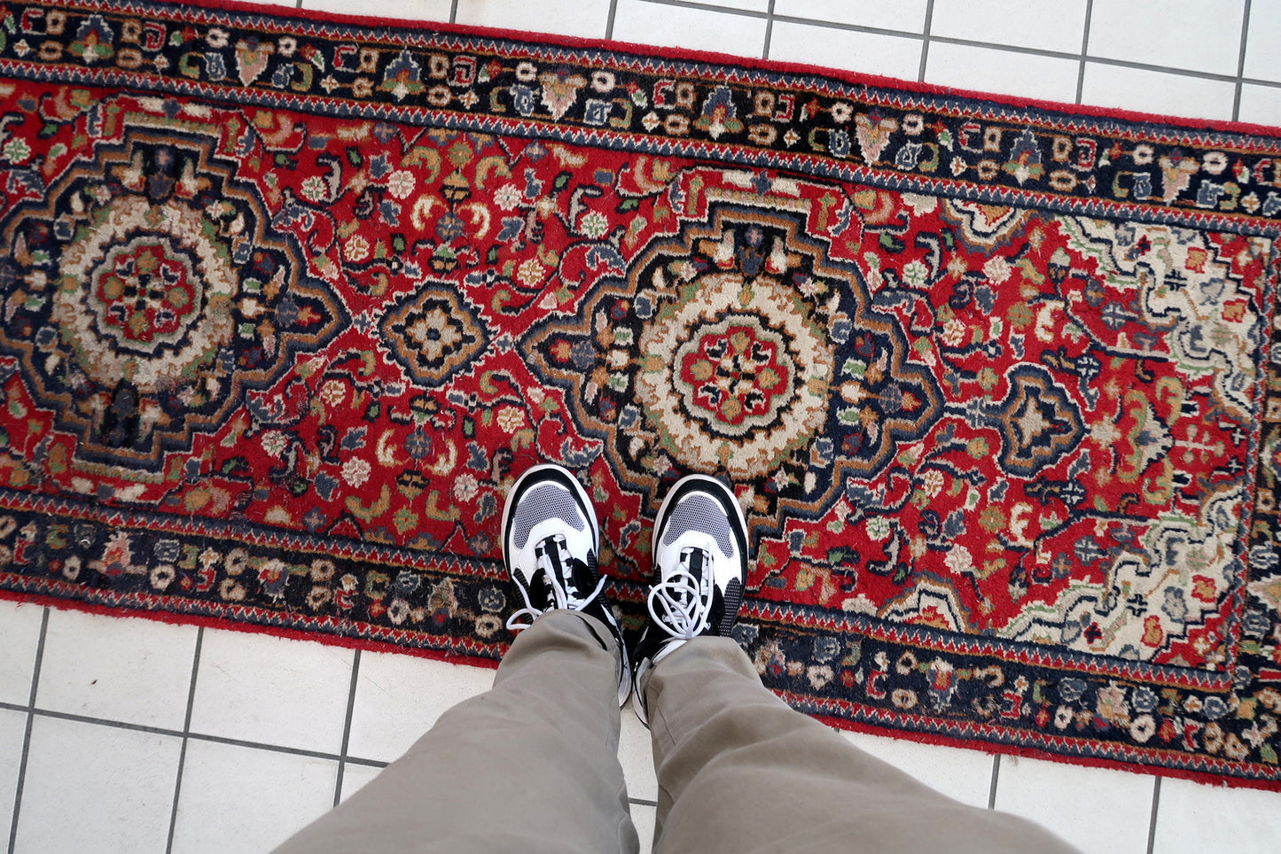 Handmade vintage Persian Malayer runner in red color. The rug has been made in wool in the middle of 20th century. It is in original condition, it has some signs of age.