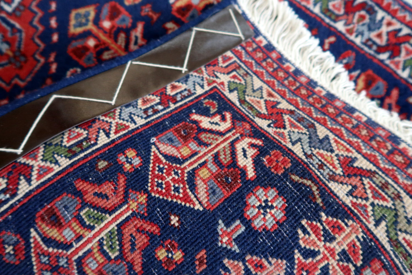 Handmade vintage Indian Tabriz narrow runner in all-over design. The rug is from the end of 20th century, it is in original good condition. The rug has been made in India but with Persian design.