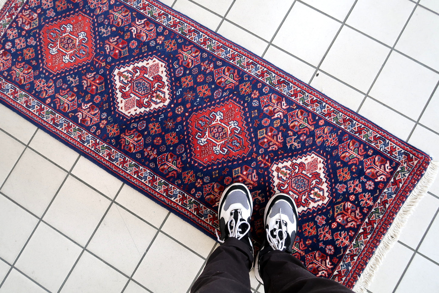Handmade vintage Indian Tabriz narrow runner in all-over design. The rug is from the end of 20th century, it is in original good condition. The rug has been made in India but with Persian design.
