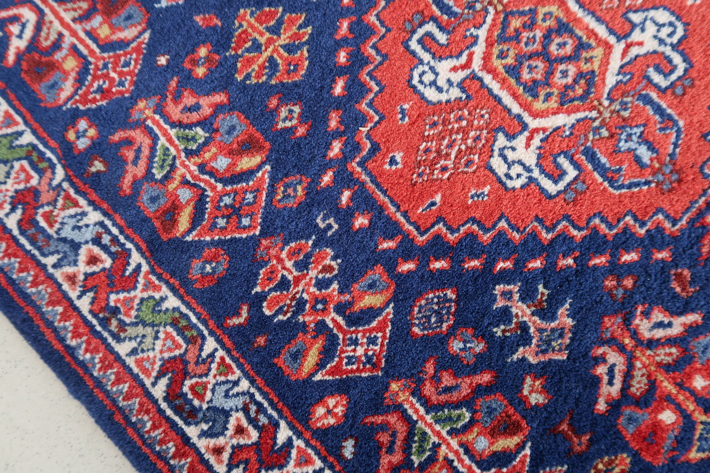 Handmade vintage Indian Tabriz narrow runner in all-over design. The rug is from the end of 20th century, it is in original good condition. The rug has been made in India but with Persian design.