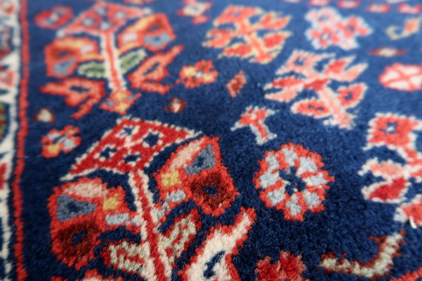 Handmade vintage Indian Tabriz narrow runner in all-over design. The rug is from the end of 20th century, it is in original good condition. The rug has been made in India but with Persian design.