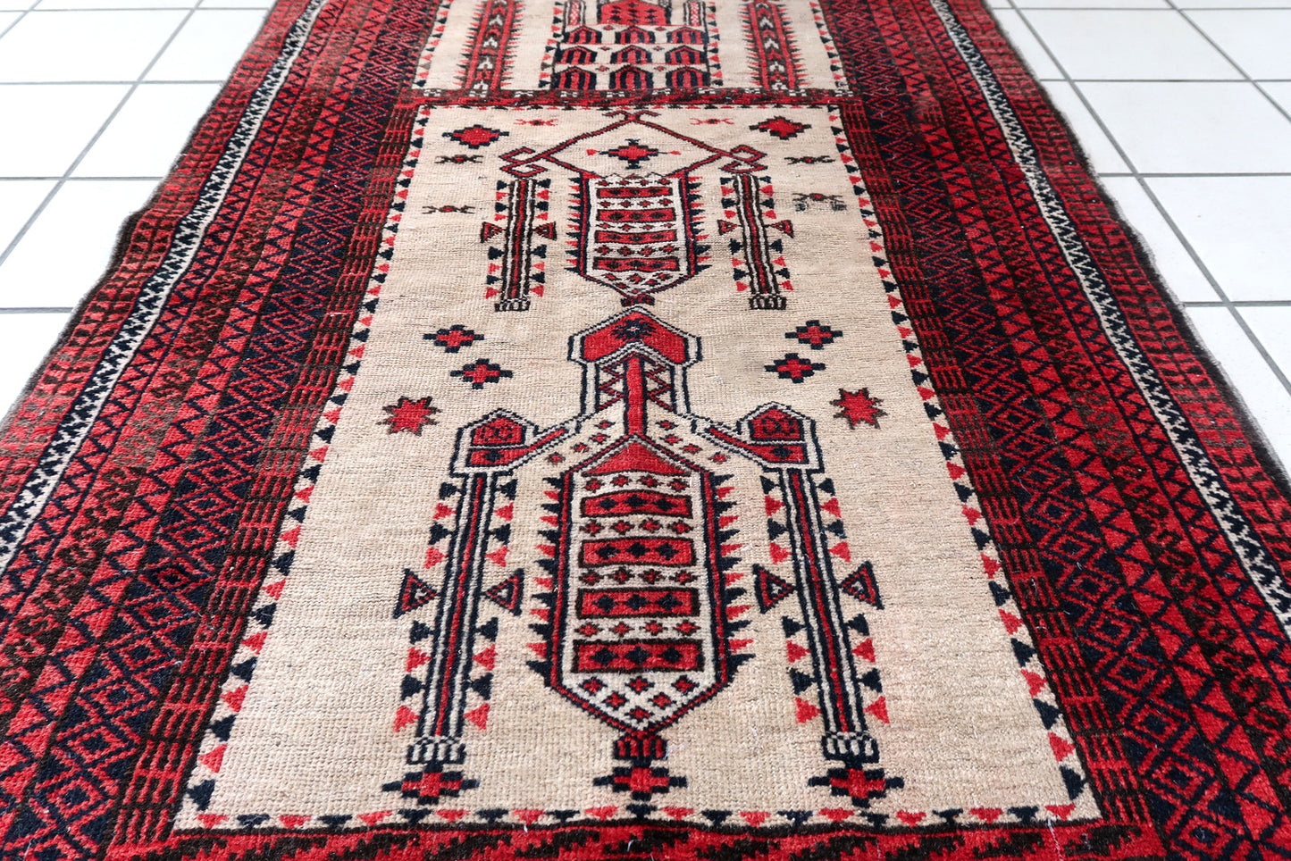 Handmade antique Afghan rug from Baluchi region. This prayer rug made in the beginning of 20th century, it is in original condition, has some low pile.