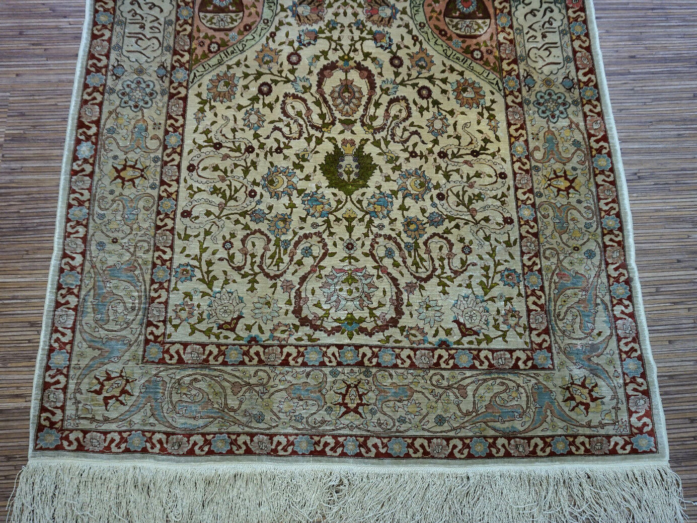 Handmade vintage Turkish Hereke rug made in natural silk and prayer design. The rug is from the middle of 20th century in original good condition.