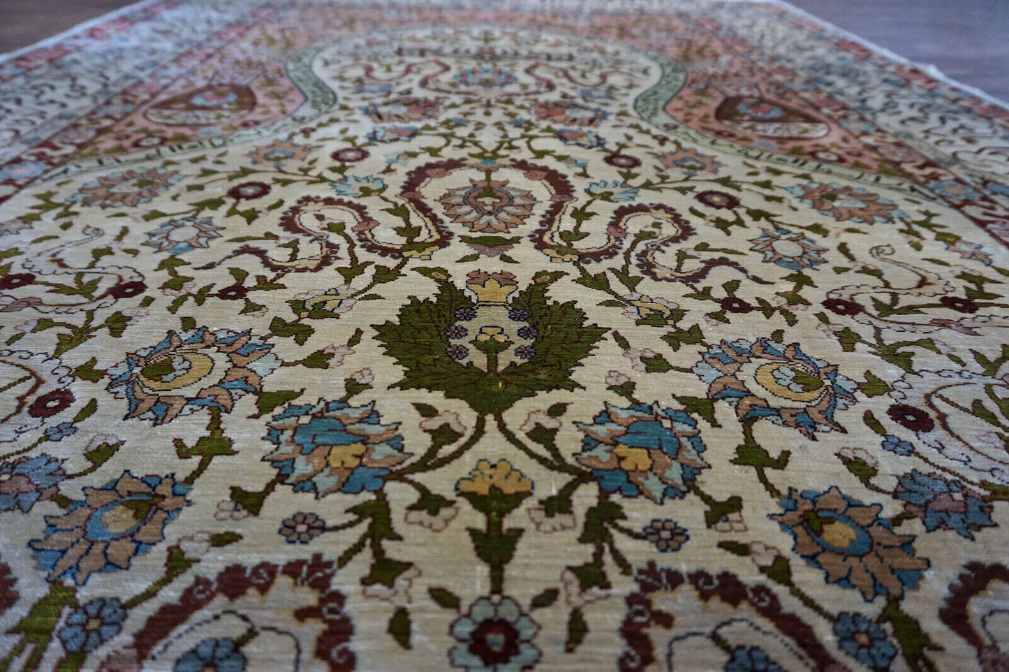 Handmade vintage Turkish Hereke rug made in natural silk and prayer design. The rug is from the middle of 20th century in original good condition.