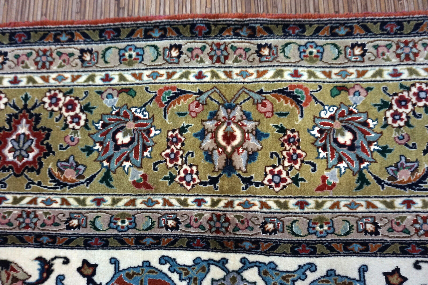 Handmade vintage Persian Tabriz square rug in classic floral design. The rug is fro;m the end of 20th century in original good condition.