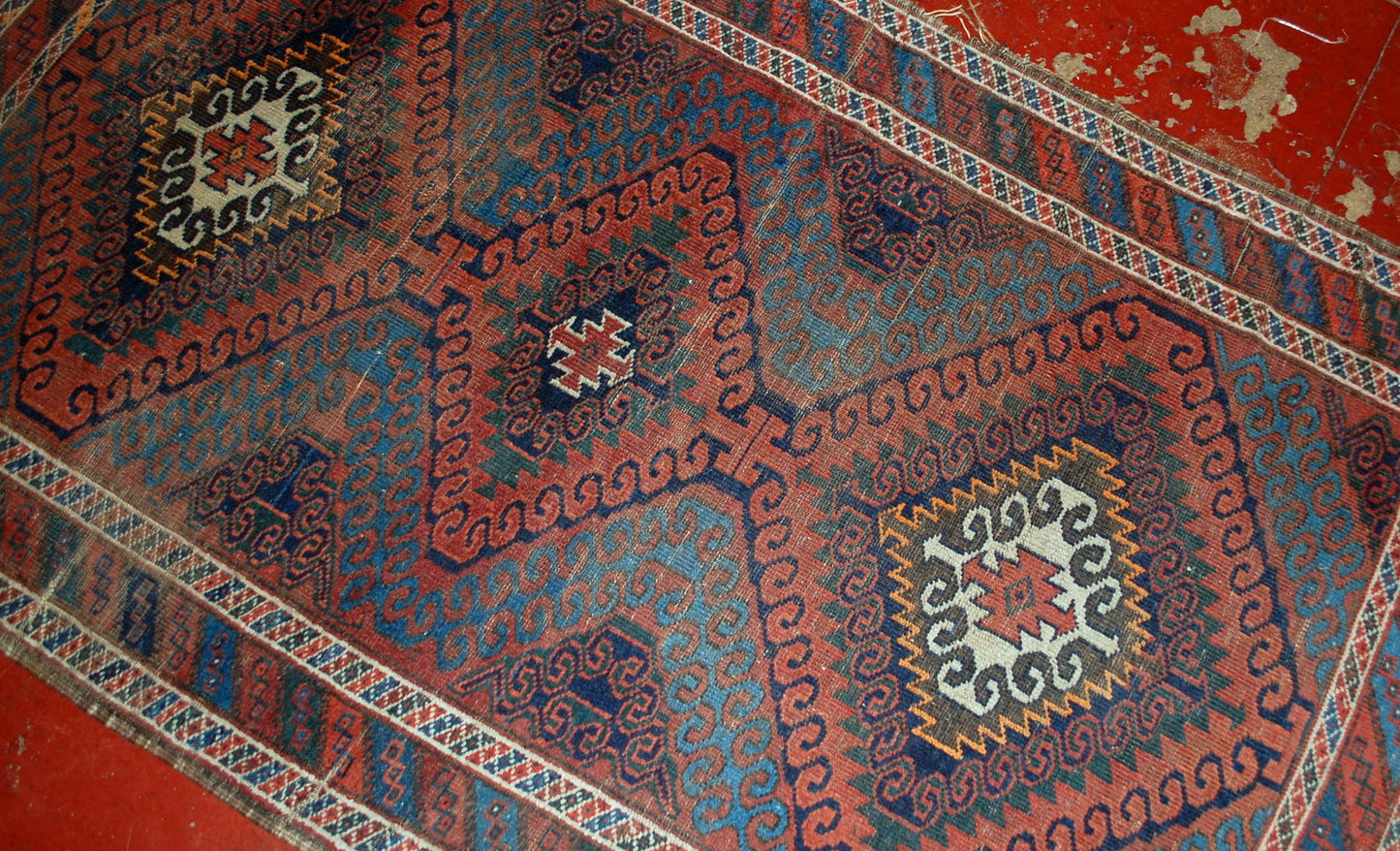 Hand made antique collectible Afghan Baluch rug in original condition, it has some low pile. The rug is from the beginning of 20th century.