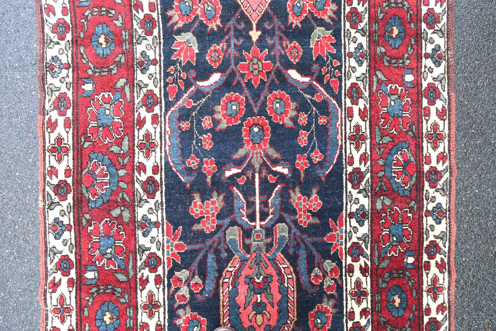 Handmade antique runner from North West in floral design and vegetable dyes. The rug is from the beginning of 20th century in original good condition.