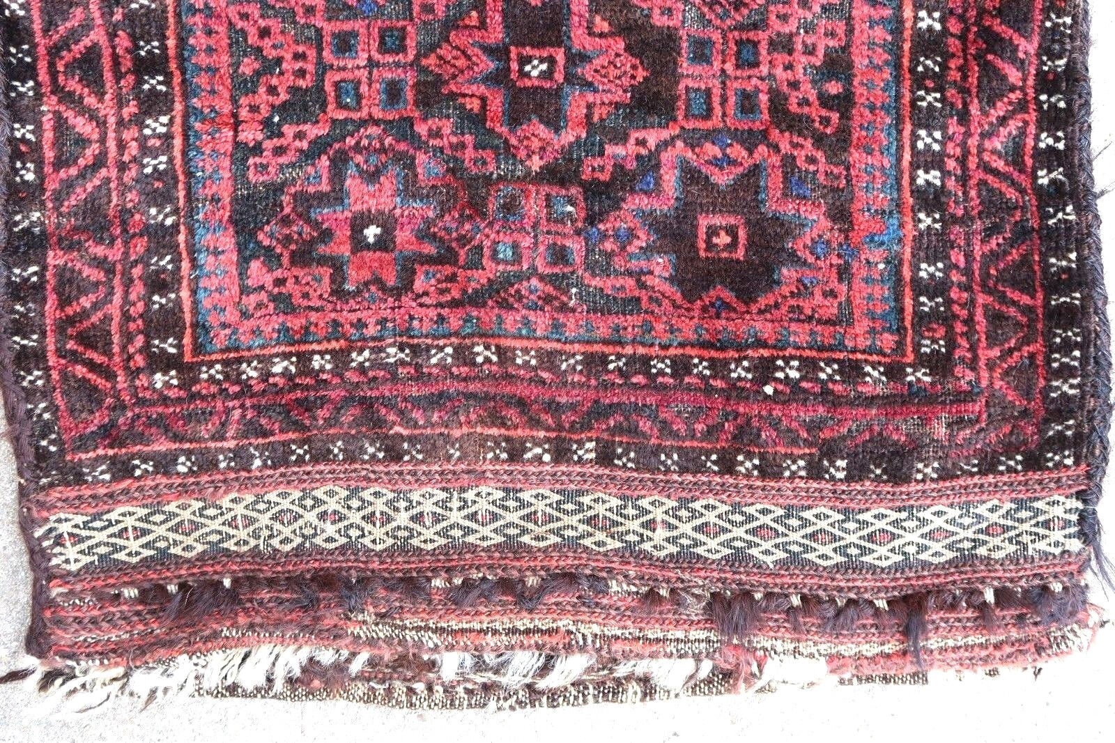 Handmade antique Afghan Baluch collectible salt bag in tribal design with the stars. The rug is from the beginning of 20th century in original condition, it has some low pile.