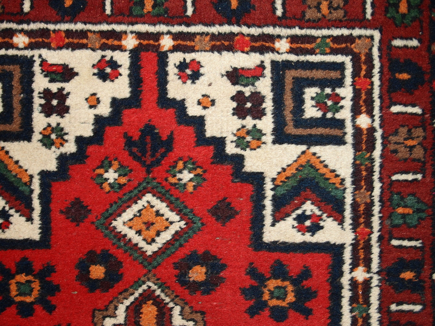 Handmade vintage Middle Eastern rug in traditional design. The rug is from the end of 20th century in original good condition.