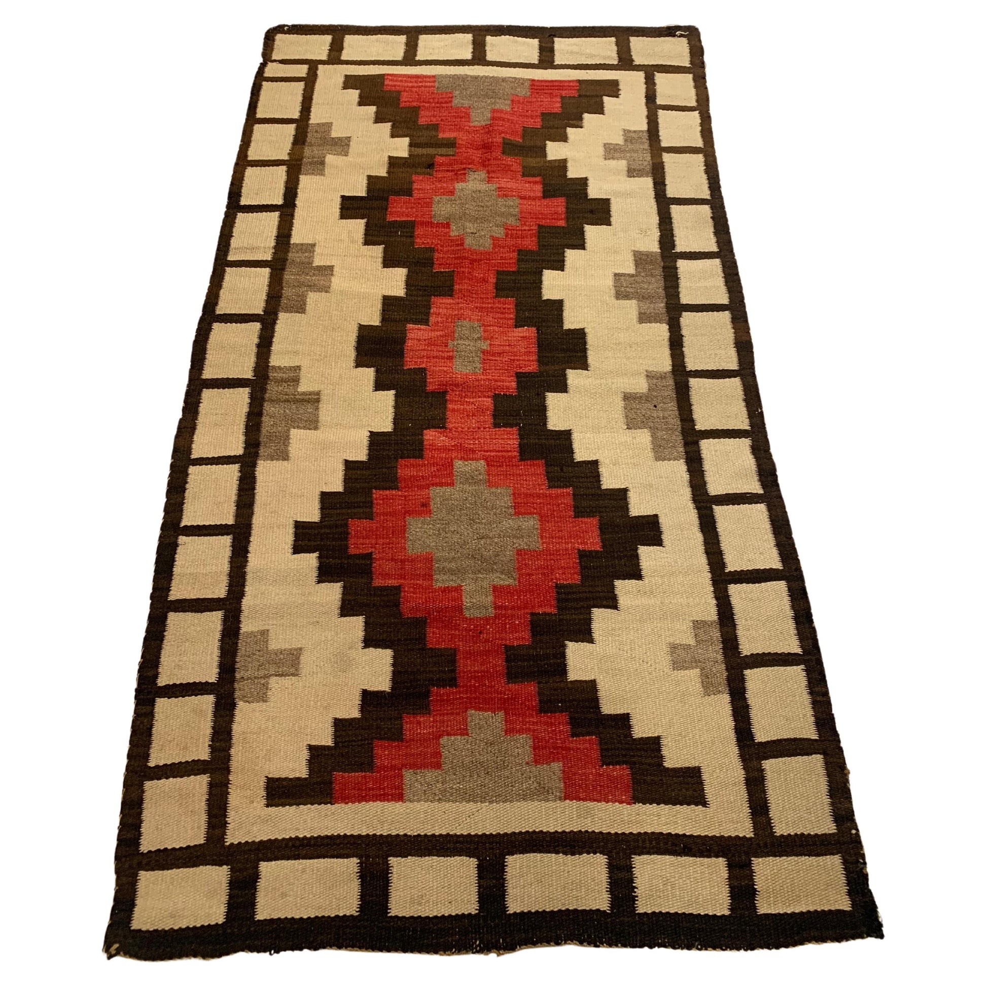 Handmade Antique Native American Navajo Rug showcased in a traditional living room setting