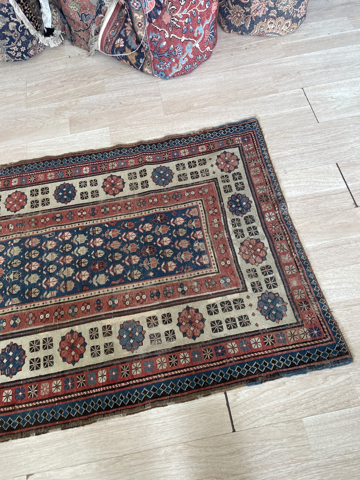 Antique hand-knotted wool rug from the Talish region, circa 1880s, in fair condition for its 140+ year age with low pile throughout, sound structure, vivid colors, and a canvas stabilization strip on one end.

